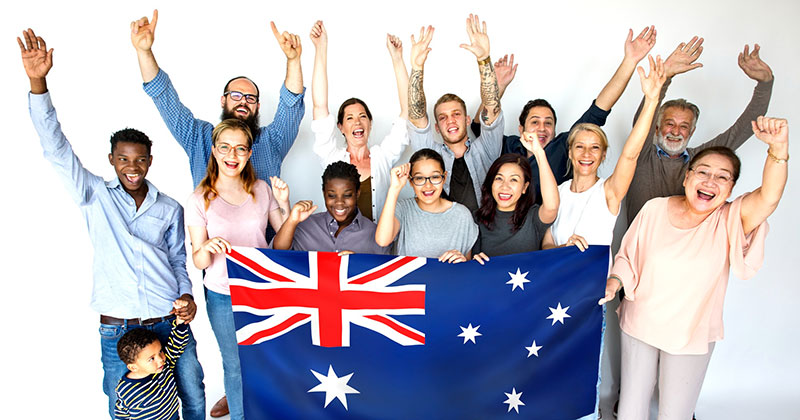 dropshipping suppliers australia - group pf people holding large australian flag, cheering